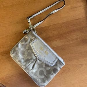 Gold C Coach Wristlet with zipper